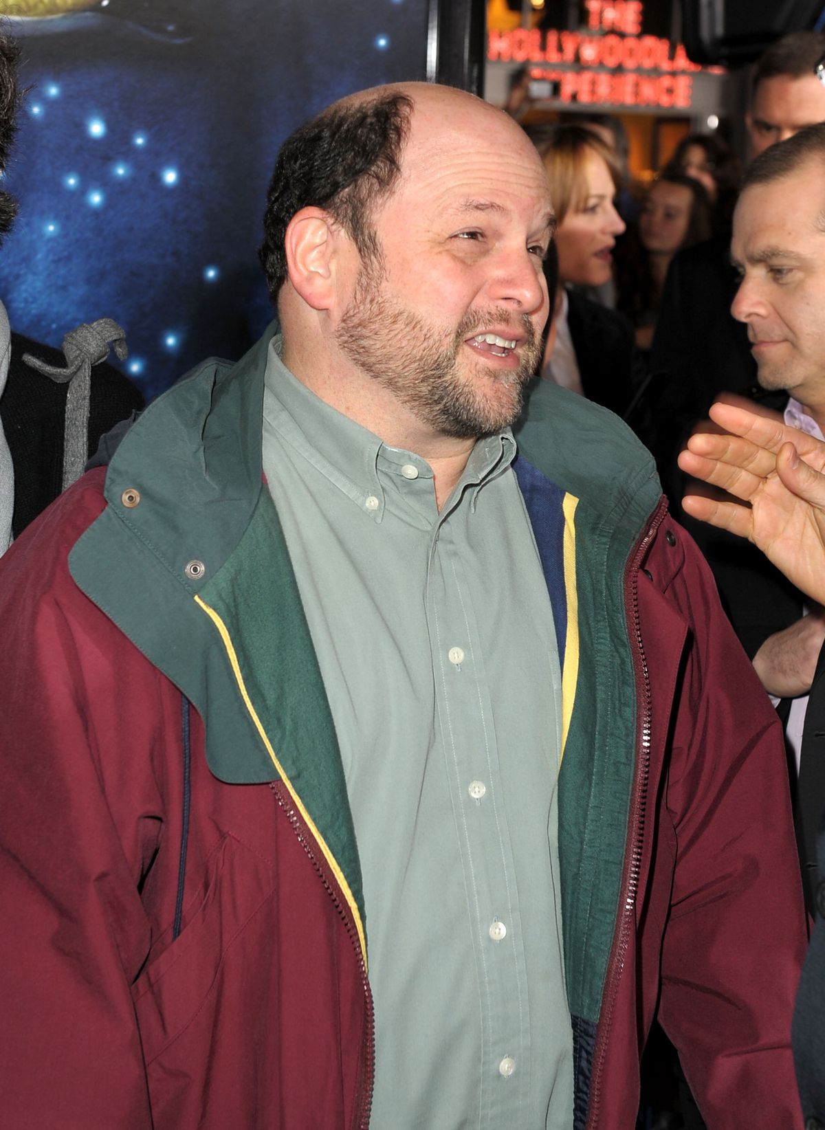 Jason Alexander wearing a red and green windbreaker at the Avatar premiere