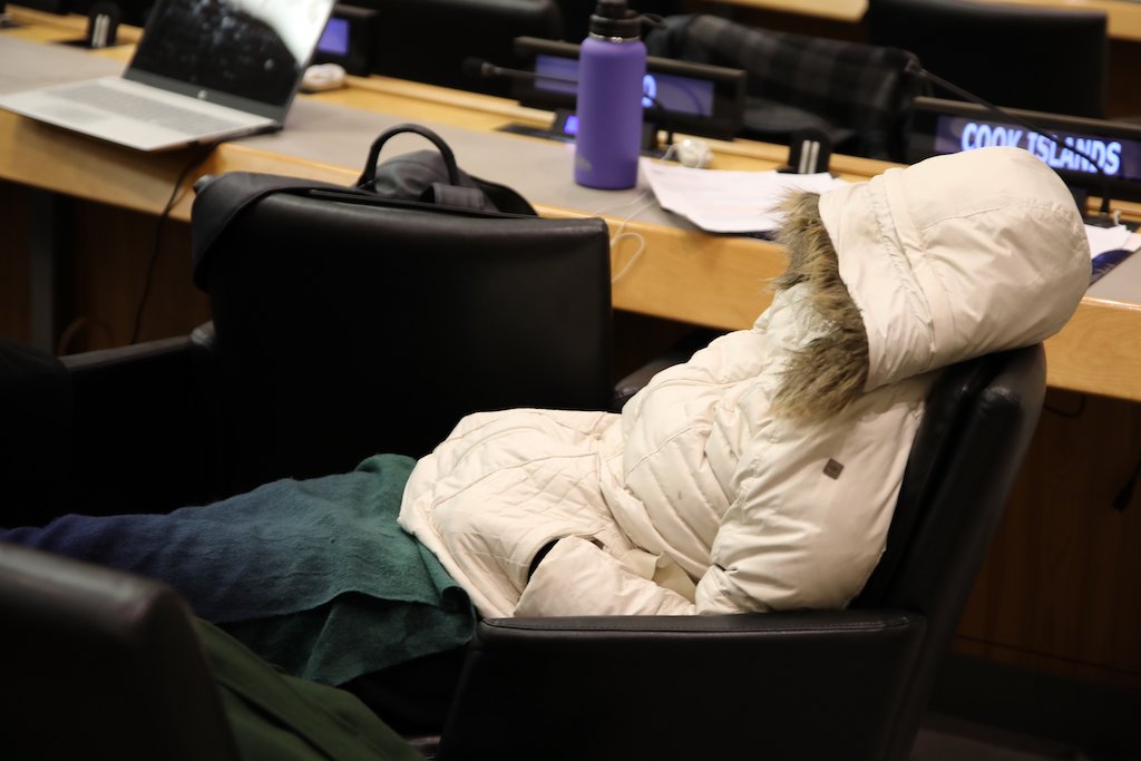 Attendee sleeping at the resumed 5th Session of the Intergovernmental Conference on BBNJ, 4 March 2023.