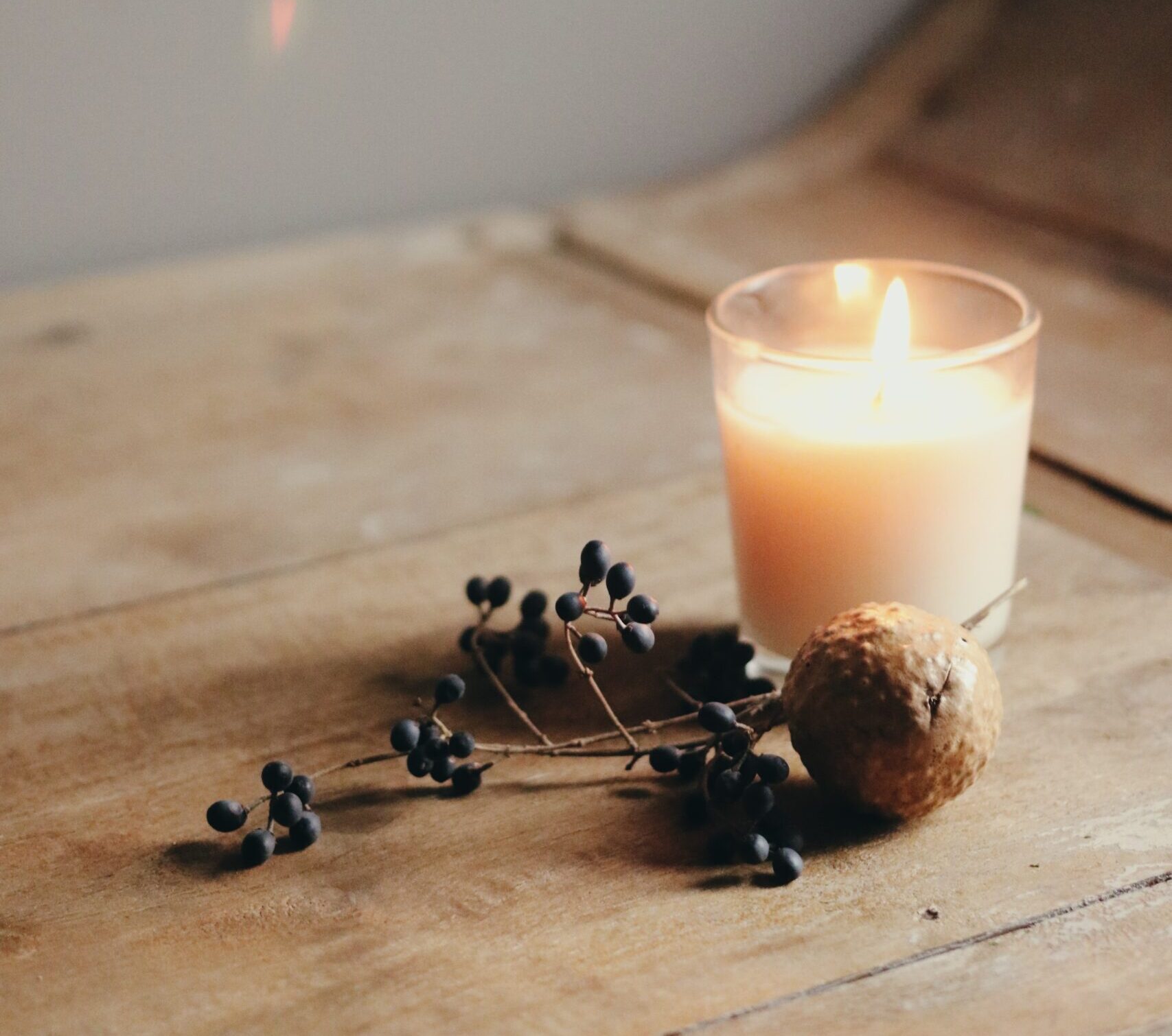 Candle on wooden table