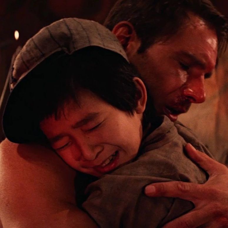 Indiana Jones hugs Short Round in Temple of Doom