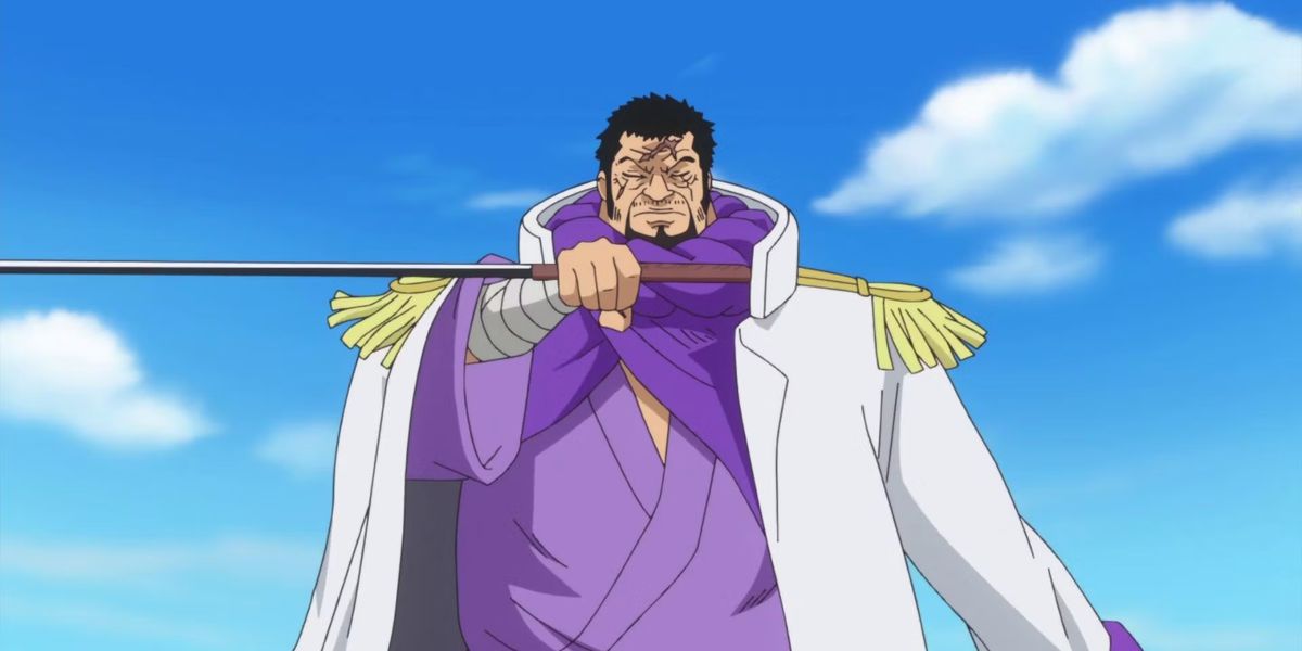 Fujitora holds a sword sideways in one piece, wearing a white jacket, a purple robe, and with his eyes closed.