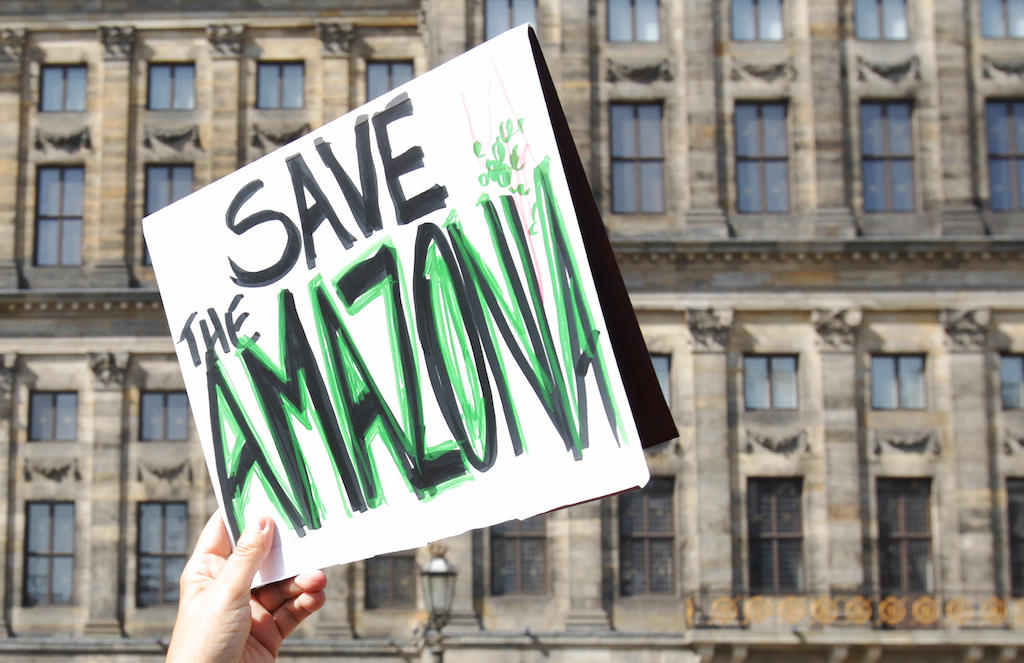 Activists participate in a demonstration in solidarity with the Amazon at Amsterdam’s Dam Square.