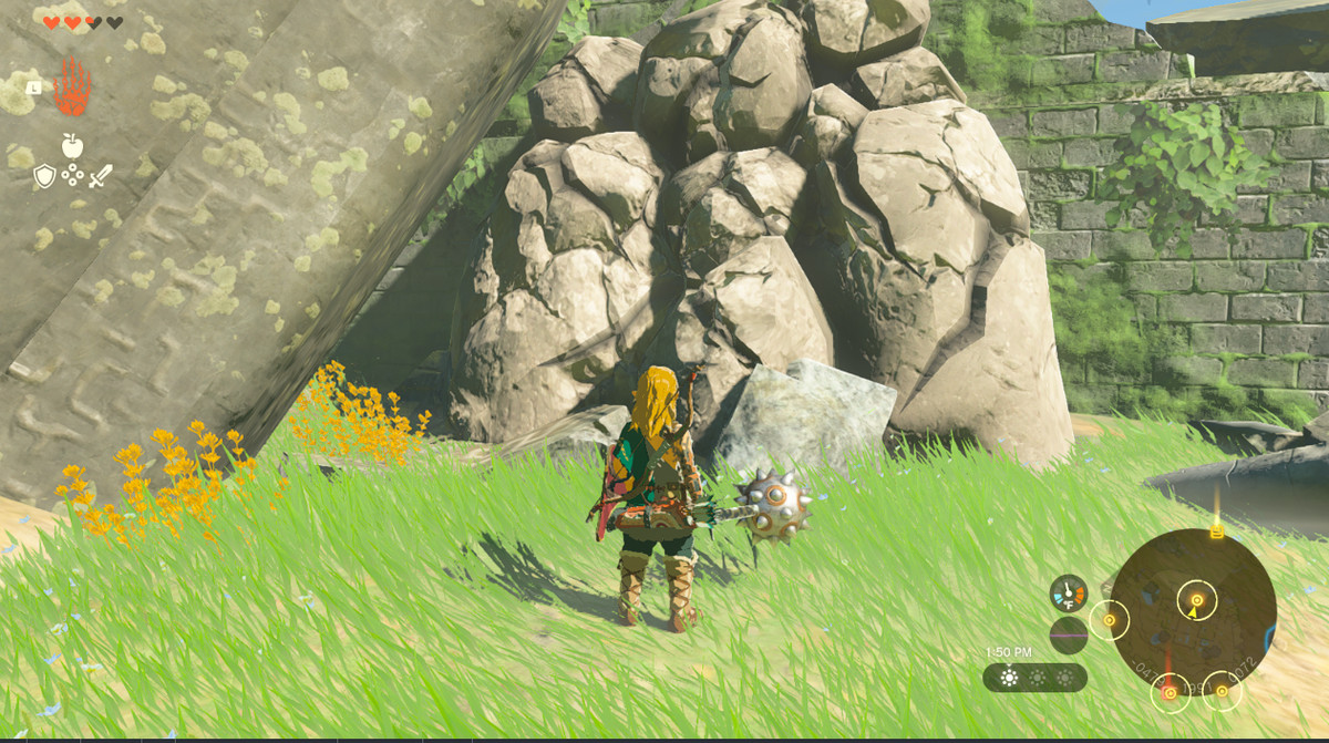 Link shatters a boulder blocking a path in Zelda Tears of the Kingdom.