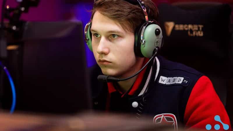 Danil “gpk” Skutin with headset on, behind his PC, plays at a LAN event for Gambit Esports