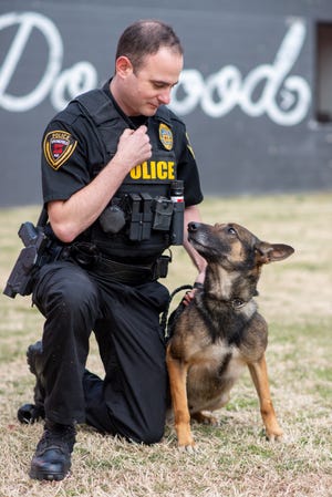 Springfield Police Officer Eric Dye with Police Service Dog Ivan. Ivan is a dual purpose service dog, meaning he is used for drug detection and searching and tracking.