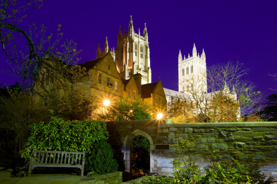 The National Cathedral and the entrance to Bishops Garden, a medieval style herb garden in Washington DC, USA