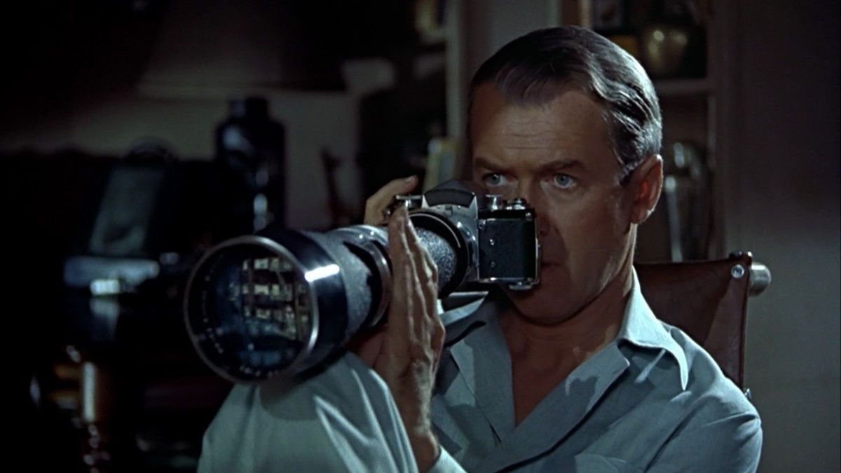 James Stewart as L. B. Jefferies looking through the lens of his camera in Rear Window.