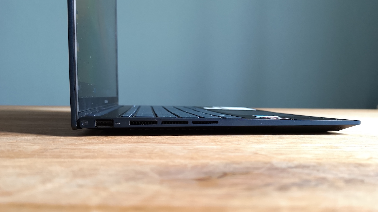 The Type-A USB port on the left hand edge of the Asus Zenbook 15 OLED