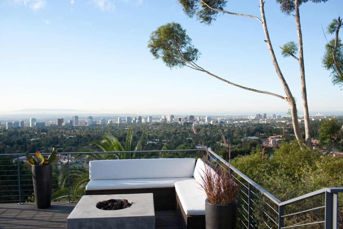 Balcony seating area overlooking cityscape california house _ getty