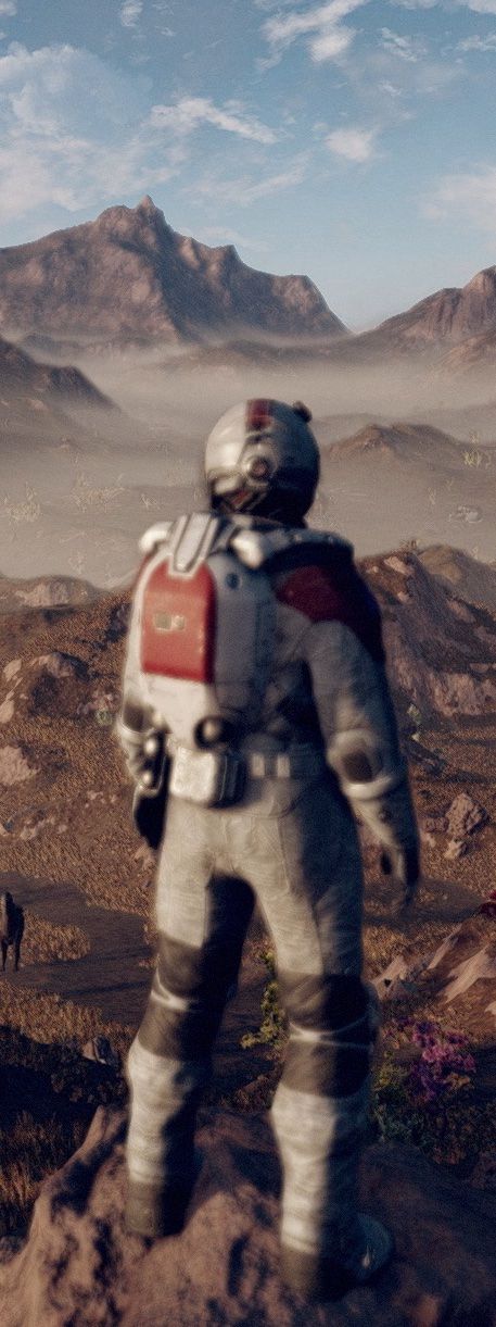 A tight vertical crop of a screenshot from Starfield featuring an astronaut standing atop a mountain looking at the blue sky above a rocky alien planet