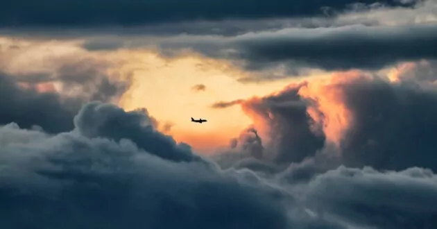 Plane flying through clouds