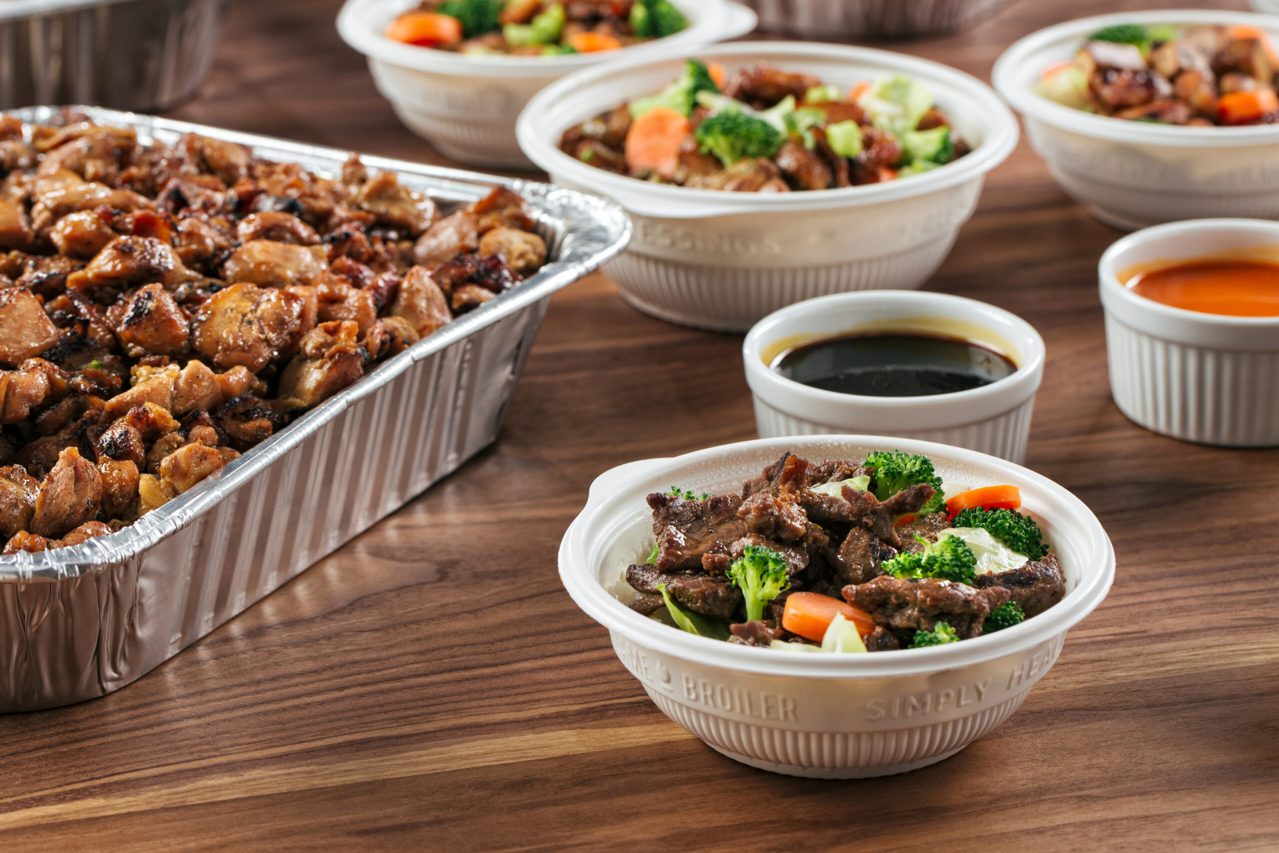 The Flame Broiler bowl with meat and vegetables in a The Flame Broiler fundraiser