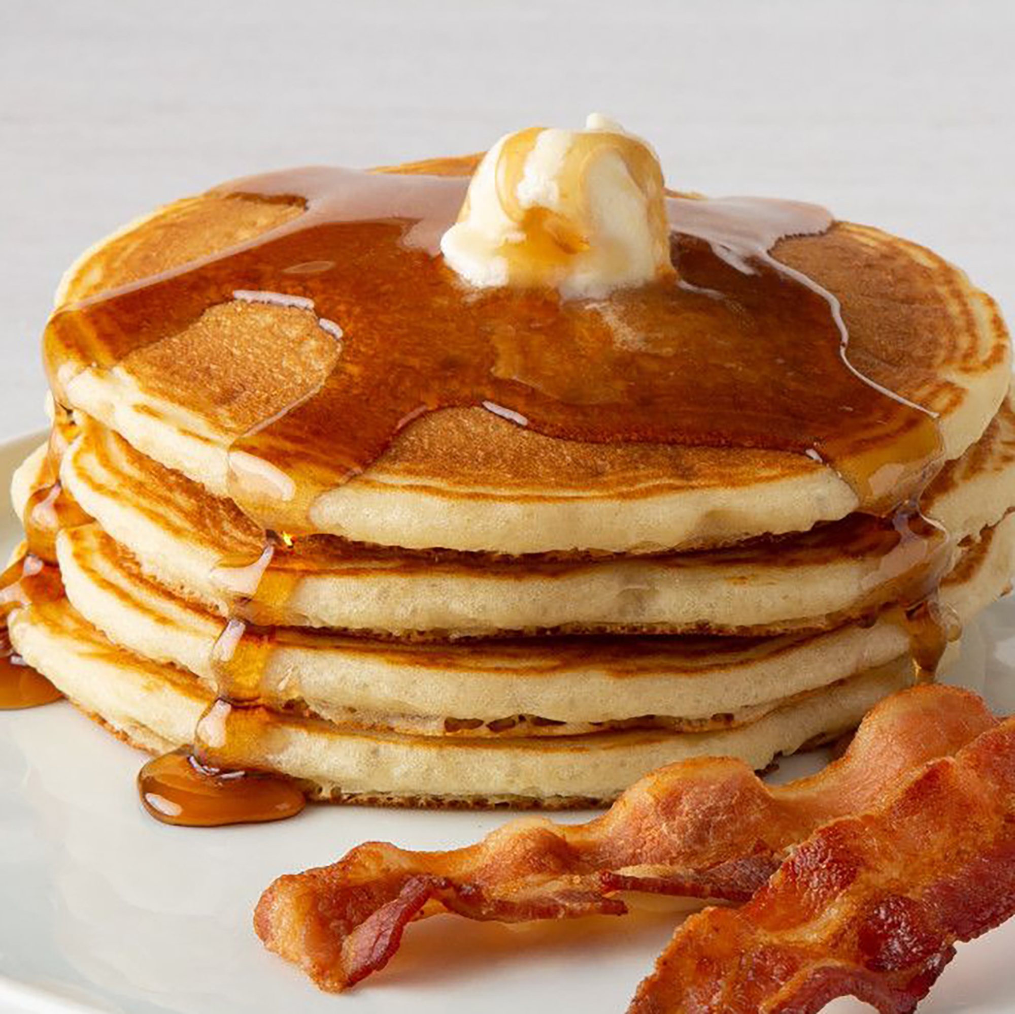 pancakes with syrup, butter and bacon - Bakers Square's menu