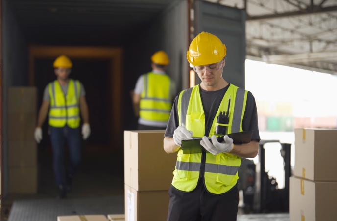 Receiving and shipping clerk performing its warehouse role