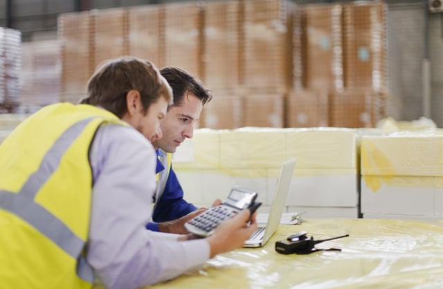 Warehouse manager calculating the cost for RFID
