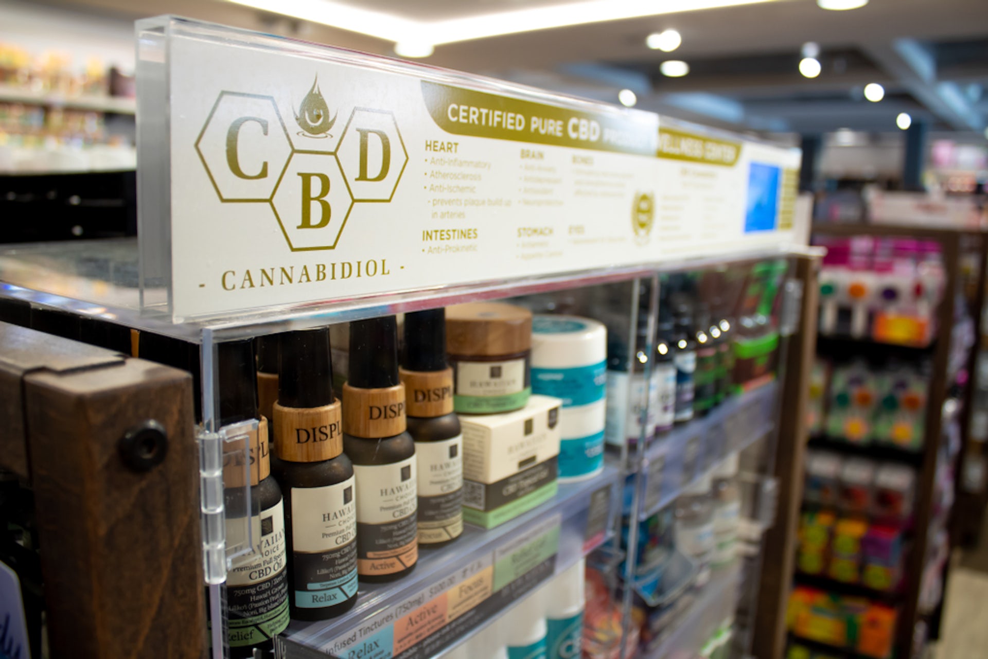 A shelf stocked with CBD products