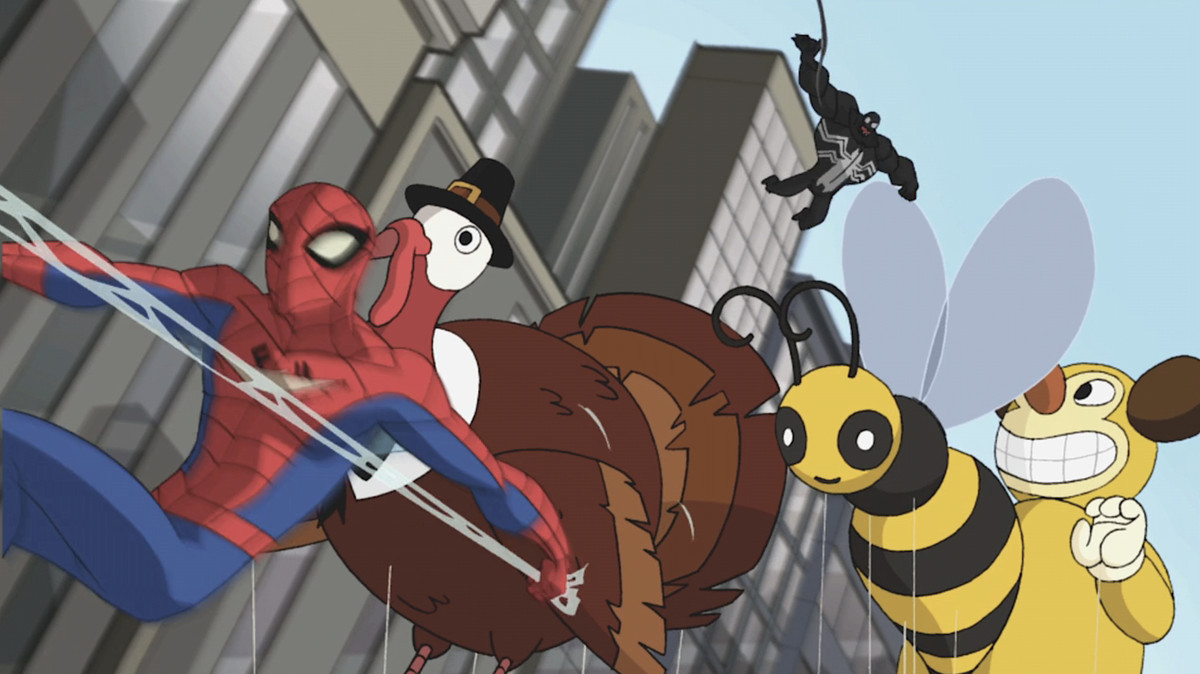 Spider-Man, dans un flou de mouvement, passe à côté d'un ballon de parade du jour de Thanksgiving représentant une dinde coiffée d'un chapeau de pèlerin, alors qu'un Venom étonnamment potelé le poursuit dans l'épisode Spectaculaire de Spider-Man « Nature Vs. Nourrir"