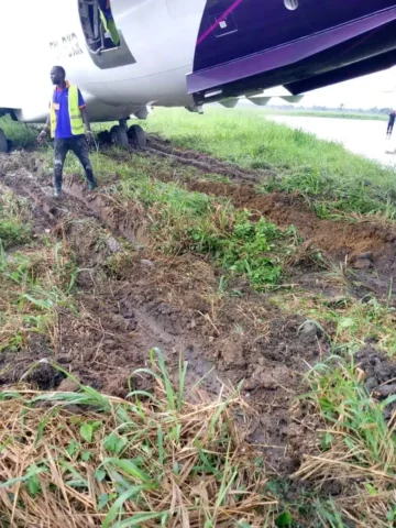 ValueJet Mitsubishi CRJ-900LR ends up in soft ground behind Port Harcourt runway
