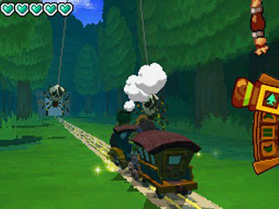 The train from Zelda: Spirit Tracks chugs along toward a spider with the health meter showing four hearts