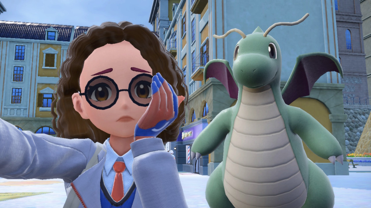 An image of a Pokemon trainer frowning in front of a Dragonite ins Pokemon Scarlet.