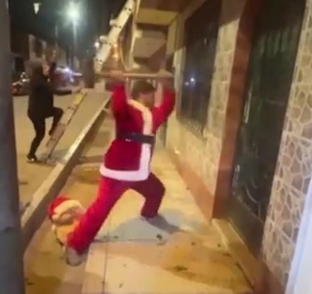 A member of the Peruvian police's Green Squad donned a Santa Claus costume during an operation last week that led to the arrest of two men who were allegedly selling cocaine and marijuana