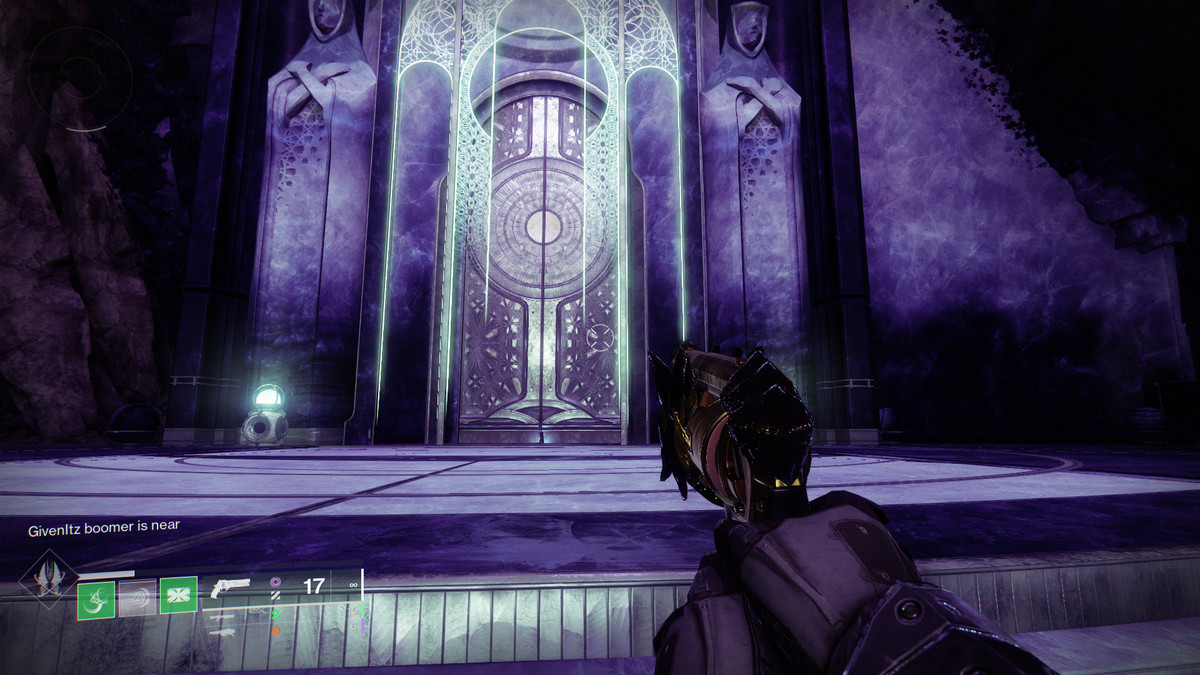 An image shows a large door, where a Starcat is hiding in Destiny 2: Season of the Wish
