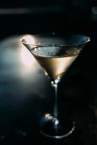 clear martini glass with black liquid