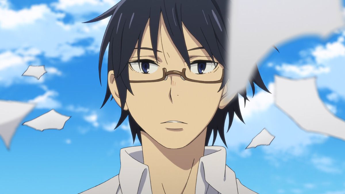 A black haired anime character (Satoru Fujinuma) with glasses stares at wafting shreds of paper in Erased.