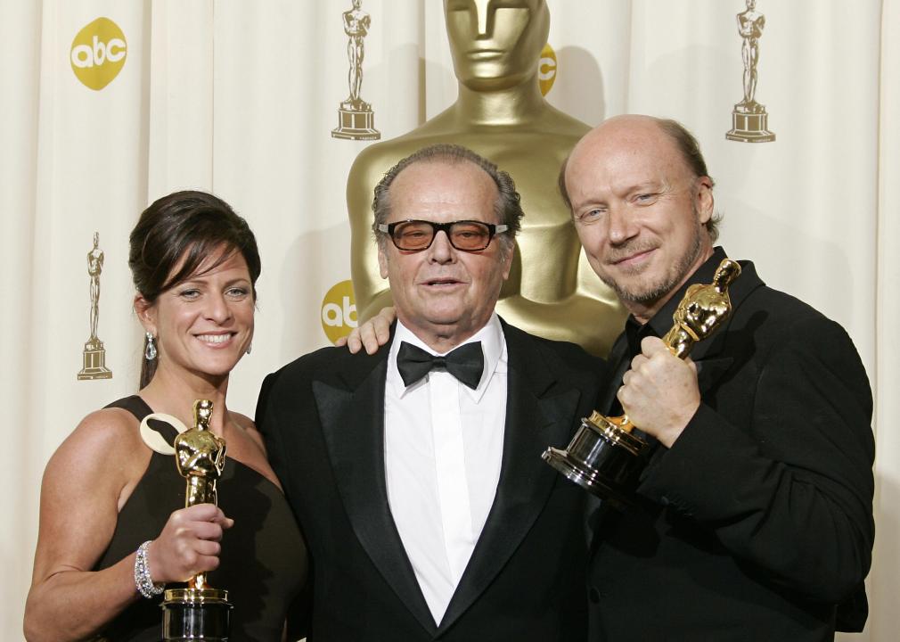 Paul Haggis and Cathy Schulman pose with Jack Nicholson and their Oscars during the 78th Academy Awards.