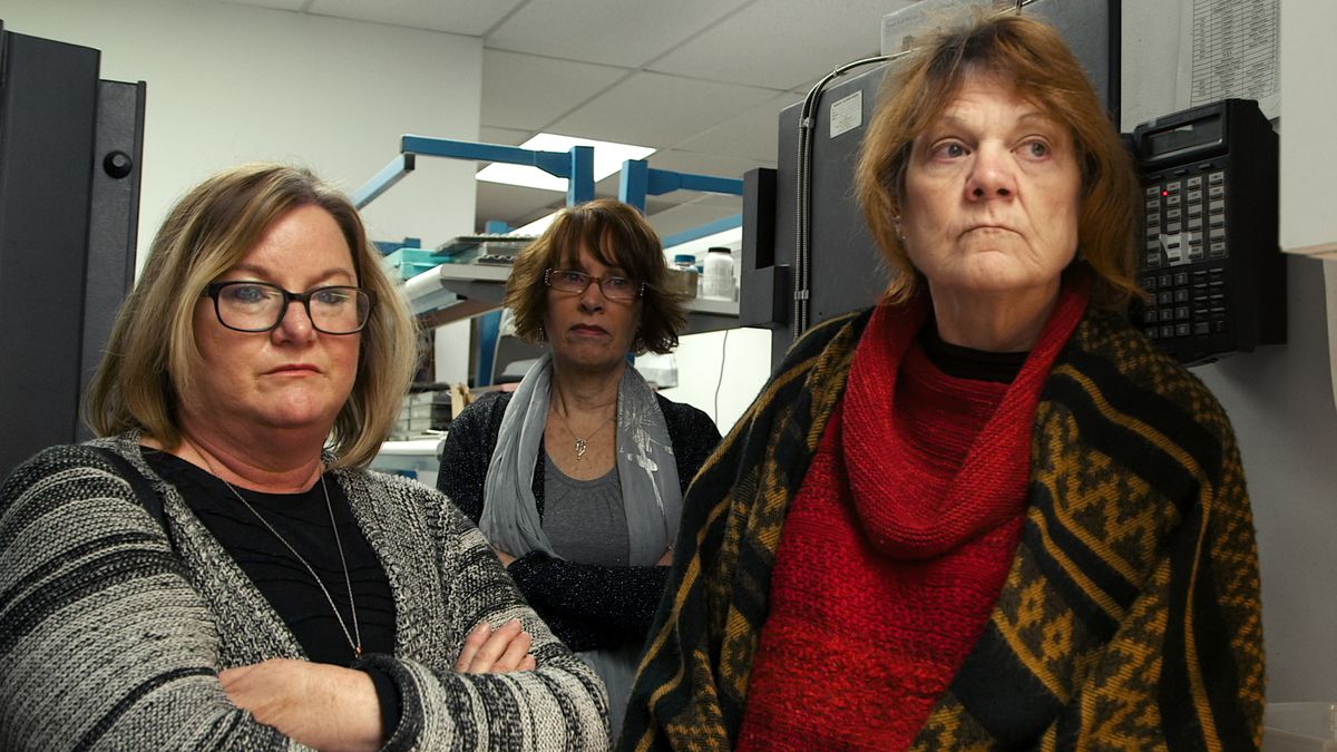 Three middle-aged women cross their arms and look off camera in The Keepers