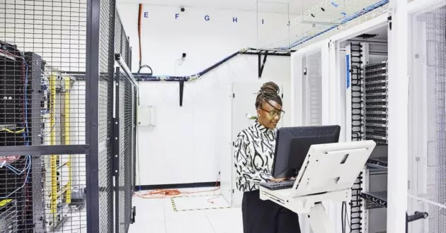 IT professional configuring server in data center