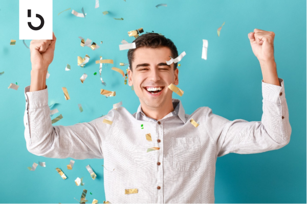 happy investor cheering with confetti