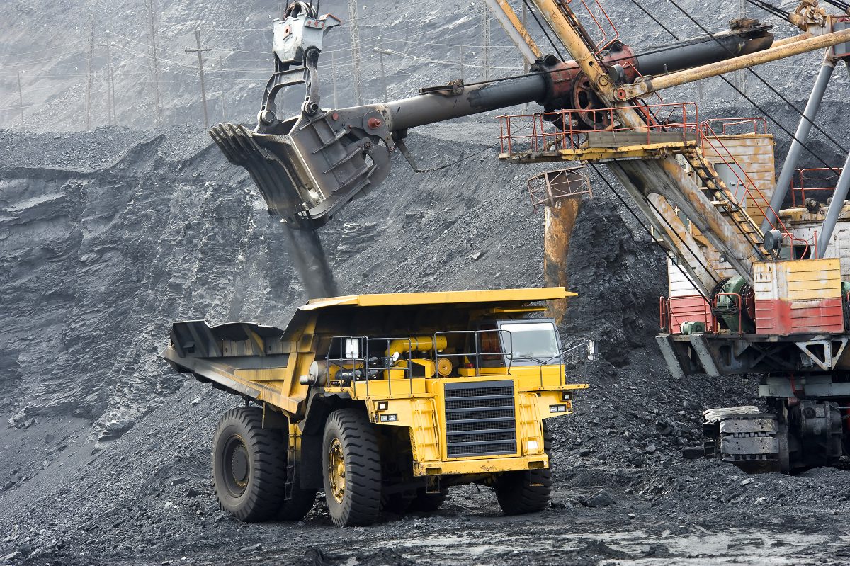 loading coal onto trucks at an open-cast mine