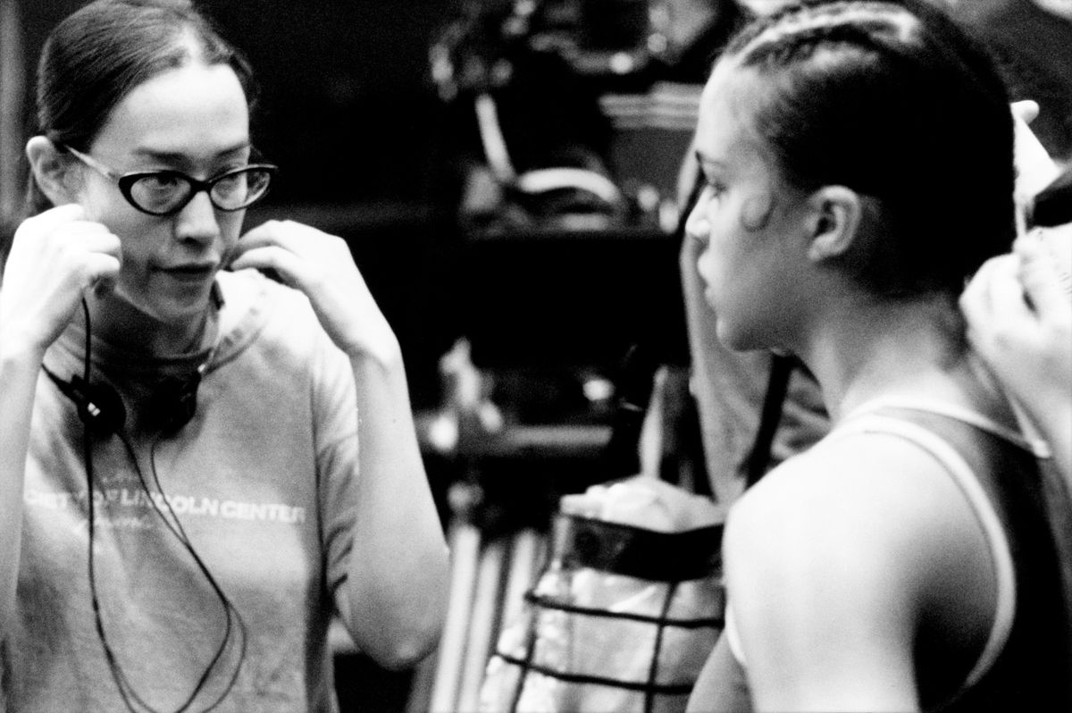 A black-and-white image of Karyn Kusama directing Michelle Rodriguez on the set of Girlfight