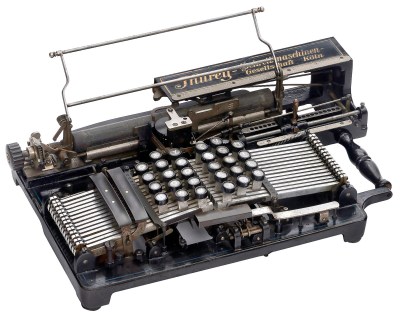 The Thurey typewriter, an old machine that resembles an autoharp.