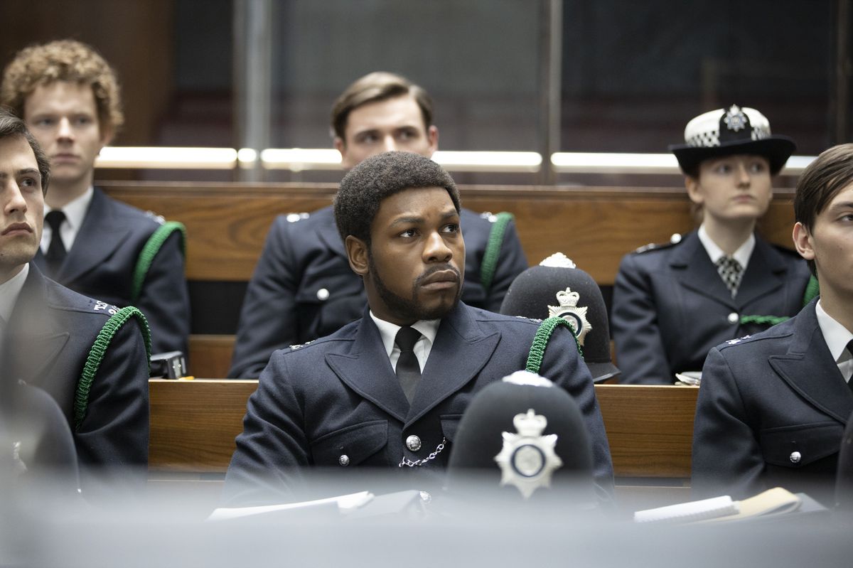John Boyega sits in police academy in Small Axe: Red White and Blue
