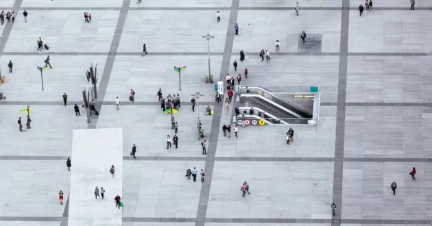 Aerial view of people walking on a city square