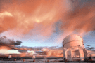 Photo showing a colourful, cloudy sky over telescope domes at Paranal Observatory